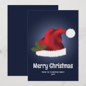 青を背景としたクリスマス・ホーリー付きの赤いサンタ帽子 シーズンカード (正面/裏面)