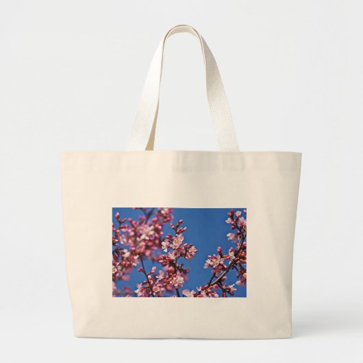 青空に触れる桜の花 ラージトートバッグ (正面)