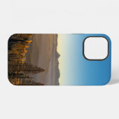 青空の下の山の上の緑の松の木 iPhoneケース (裏面横)