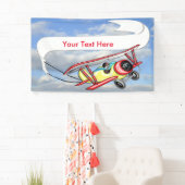 青空及び白い雲の複葉機の牽引の旗 横断幕 (インサイチュ)