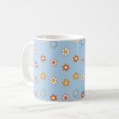 青色の背景に色とりどりの花 コーヒーマグカップ (正面左)