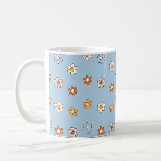 青色の背景に色とりどりの花 コーヒーマグカップ (左)