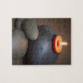 静かに岩で燃える蝋燭 ジグソーパズル (横)