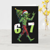面白いクリスマスのエイリアンシックスセブンメーム 67 サンタ帽子 カード (黄色い花)