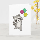 風船をかわいい動物の上に飛ぶタヌキ子供へ カード (黄色い花)