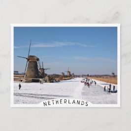 風車に沿ったスケートで滑る氷は冬になると ポストカード