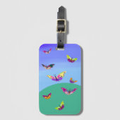 飛んでいる数々の色の蝶 ラゲッジタグ (正面縦)
