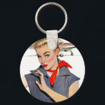 飛行機を盗んだ少女 キーホルダー<br><div class="desc">アーティスト:Coby Whitmore |青いジャンプスーツと赤いバンダナの飛行機の前の女の子</div>