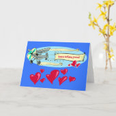 飛行機アニメの誕生日メッセージ カード (黄色い花)
