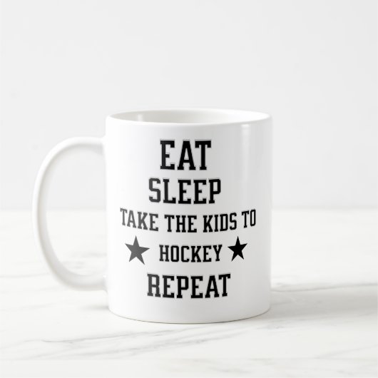 食べ寝る子供をホッケーの繰り返しに連れて行く、 コーヒーマグカップ (左)