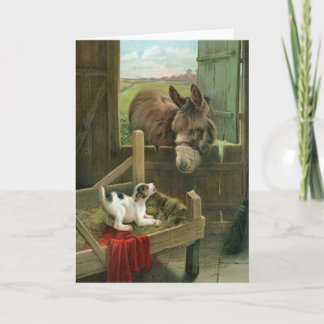 飼い葉桶の古い納屋周囲の庭のヴィンテージのろば及び小犬 シーズンカード