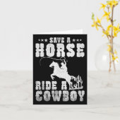 馬がカウボーイの馬に乗っおもしろいて男性に乗るのを除く カード (黄色い花)