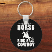 馬がカウボーイの馬に乗っおもしろいて男性に乗るのを除く キーホルダー (正面)