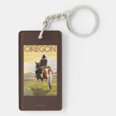 馬の背のヴィンテージ旅行ポスターのカウボーイ キーホルダー (裏面)