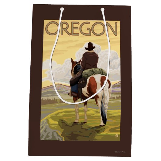 馬の背のヴィンテージ旅行ポスターのカウボーイ ミディアムペーパーバッグ (裏面)