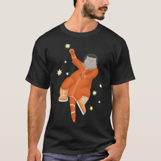 駅の中のオレンジ色の宇宙飛行士 Tシャツ