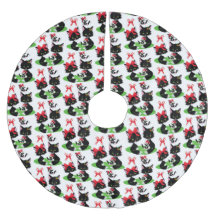 髪に弓を付けた小さな黒い子猫が二匹