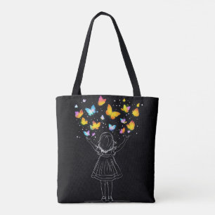 魔法の蝶が小さな女の子の手から現れる トートバッグ