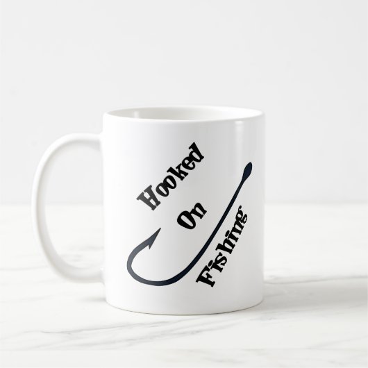 魚釣り-おもしろいのコーヒー・マグで引っ掛けられる コーヒーマグカップ (左)