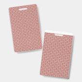 鮮やかな赤とピンクの織物が、柄の入ったラグの上に敷かれている バッジ (正面&裏面)