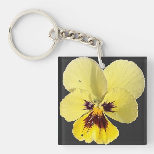 鮮やかな黄色のパンジーの花の写真アクリルキーホルダー キーホルダー (正面)