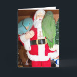 鳥のクリスマスカードとサンタの訪問 シーズンカード<br><div class="desc">この2人のパロットレットはクリスマスだと聞いて、サンタと特別なアポイントメントを組んで、素敵な男の子や女の子のリストに入った。写真は緑と青のパシフィックパロットレットのペアで、サンタと一緒に訪れ、彼らにとって良いおもちゃを見に行く。</div>