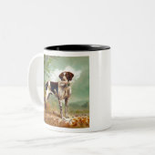鳥を口に入れたハンター犬 ツートーンマグカップ (正面左)