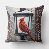 (鳥)ショウジョウコウカンチョウの鳥が雪に覆われた通り灯の上に座った クッション (正面)