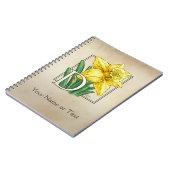 黄色いラッパスイセンのパーソナライズなモノグラム ノートブック (左側)