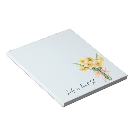 黄色い水仙の花 桃色のリボン ノートパッド (アングル)