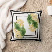 黄色い花の付いた白黒の枕 クッション (ブランケット)