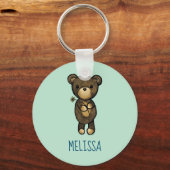 黄色い花の花を持つかわいい茶色のカスタムクマ キーホルダー (正面)