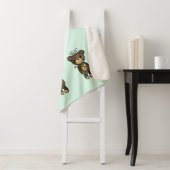 黄色い花を持つかわいい茶色のクマ シェルパブランケット (インサイチュ)