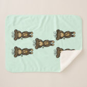 黄色い花を持つかわいい茶色のクマ シェルパブランケット (正面(横))