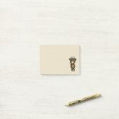 黄色い花を持つかわいい茶色のクマ ポストイット (デスク上)