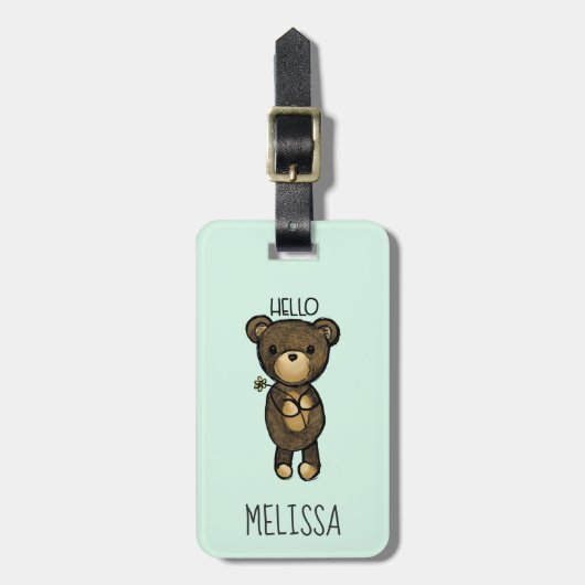 黄色い花を持つかわいい茶色のクマ ラゲッジタグ (正面縦)