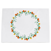 黄色と赤のバラの花を持つフローラの丸い枠 ラージペーパーバッグ (正面)