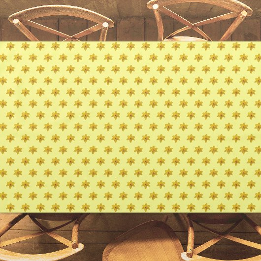 黄色の水仙の花の継ぎ目のないパターンがオン テーブルクロス