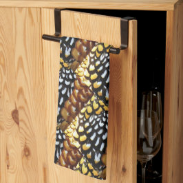 黄色、茶色、黒のキッチンタパターン（の模様が）あるオル キッチンタオル