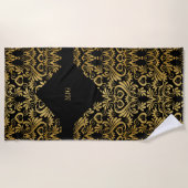 黄金の渦巻きモノグラムの黒 ビーチタオル (正面)