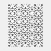 黒いドットで作られた幾何学的な4つのローブのパターン フリースブランケット (正面)