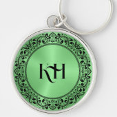 黒いフローラ円メタリックグリーン背景 キーホルダー (正面)