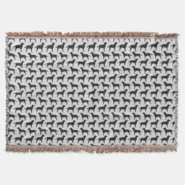 黒いラブラドル・レトリーバー犬はパターンのシルエットを描きます スローブランケット