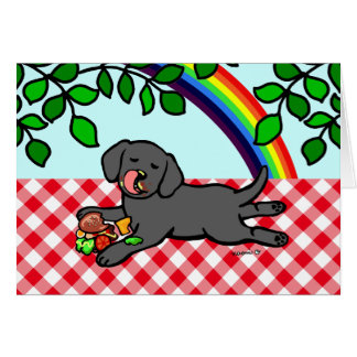 黒いラブラドールの子犬およびハンバーガー