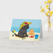 黒いラブラドールの子犬の麦わら帽子の漫画 カード (黄色い花)