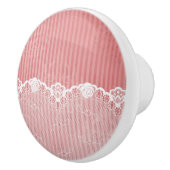 黒いレースが付いているピンクおよび白い背景 セラミックノブ (右)