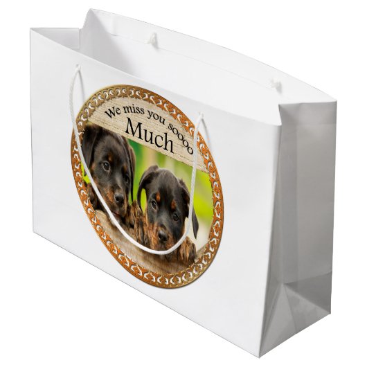 黒いロットワイラーかわいい子犬と悲しい顔 ラージペーパーバッグ (裏面アングル)
