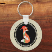 黒い円の中のクリスマスハットのかわいいキツネ キーホルダー (正面)