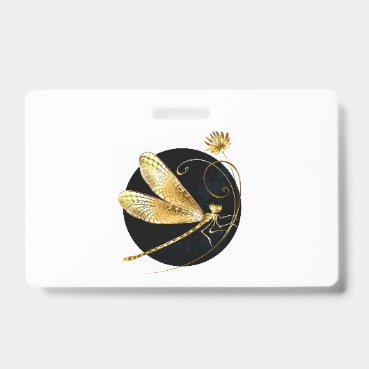 黒い円の中の金色のトンボ バッジ (正面)