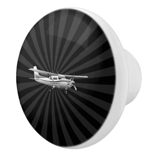 黒い日が差すことを飛ばす航空機のセスナのシルエット セラミックノブ (右)